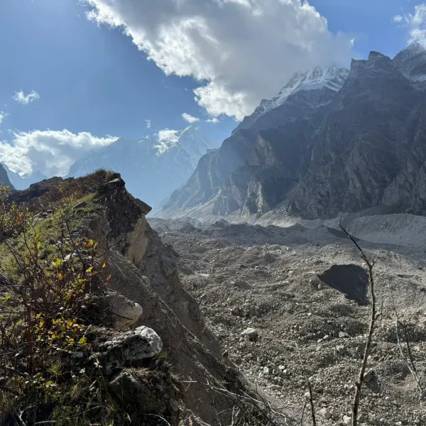 The moraine of the Satopanth Glacier with snow-covered peaks rising behind