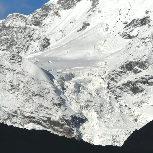 The snow-covered slopes and icefall of Svargarohini