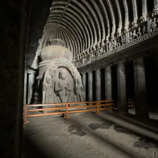 The vaulted Buddhist prayer hall at Ellora with a seated Buddha before the stupa