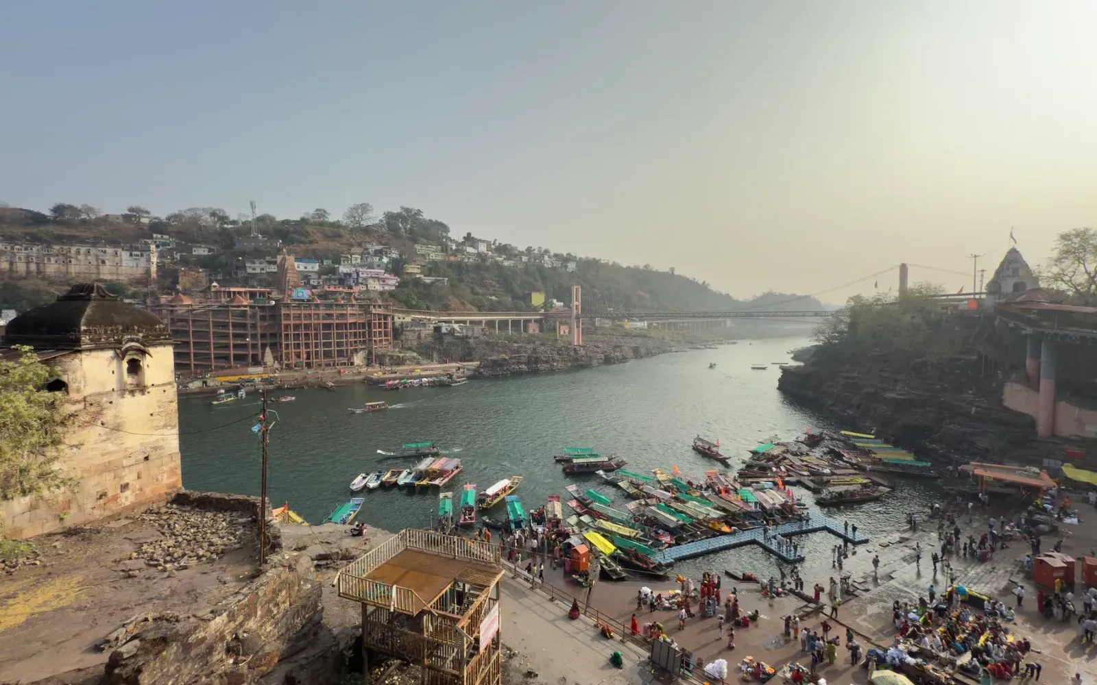 The Narmada at Omkareshwar with boats, ghats and the temple on the island